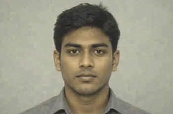 Younger clean-shaven adult version of a fictional man in a low-detail degraded reference portrait