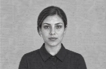 Younger adult version of a fictional woman, with uncovered hair, in a low-detail degraded reference portrait