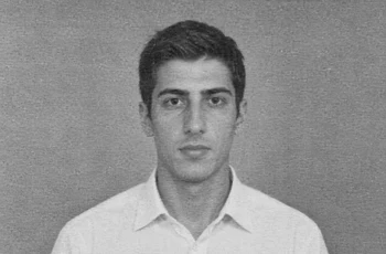 Younger clean-shaven adult version of a fictional man in a low-detail degraded reference portrait
